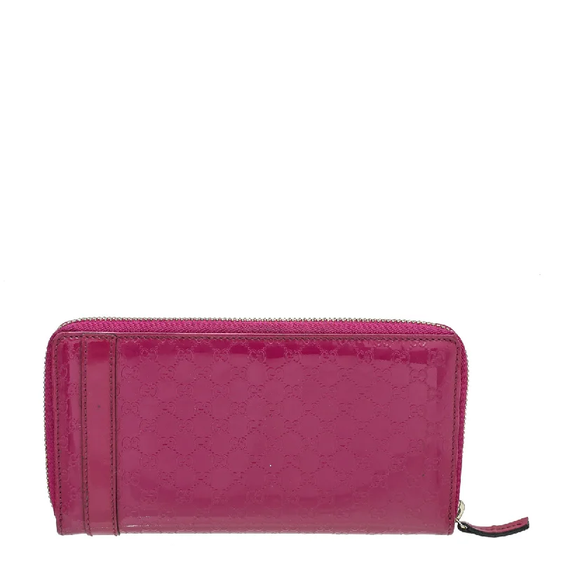 Women Gucci crossbody bags with a printed floral patternGucci Fuchsia MicroGuccissima Nice Wallet