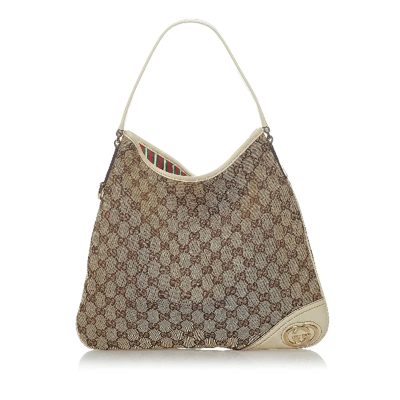 Ladies Gucci shoulder bags with a tassel decorationGucci GG Canvas New Britt Shoulder Bag