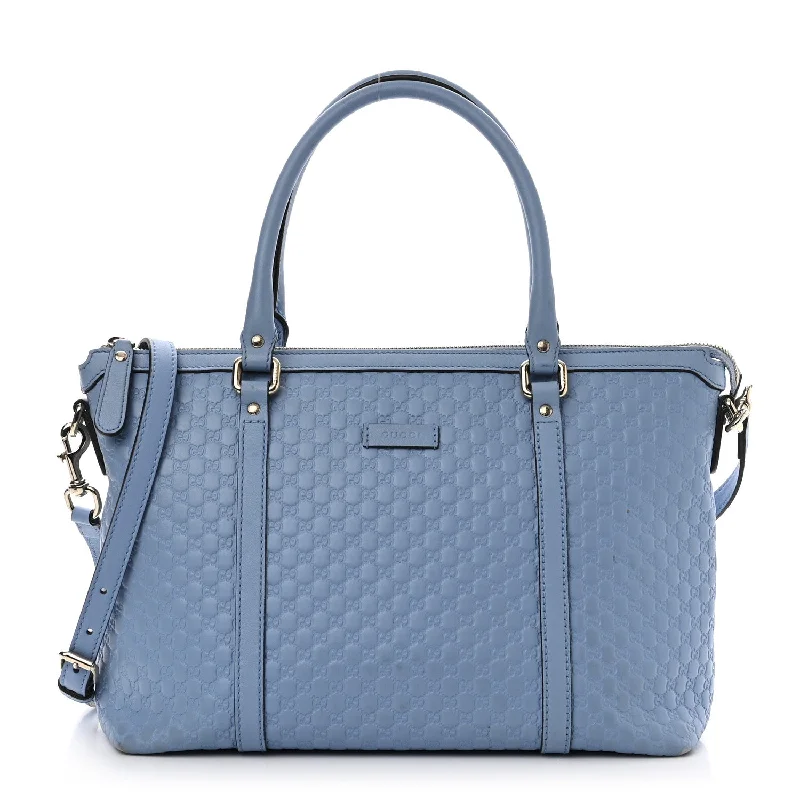 Women Gucci Sylvie bags with a crystal - embellished web stripeGucci Soft Microguccissima Small