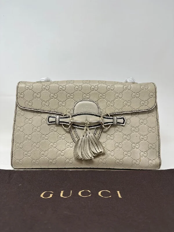 Women Gucci Sylvie bags with a monogram - embossed leatherGucci Emily Beige Leather GG Monogram Shoulder Bag Medium