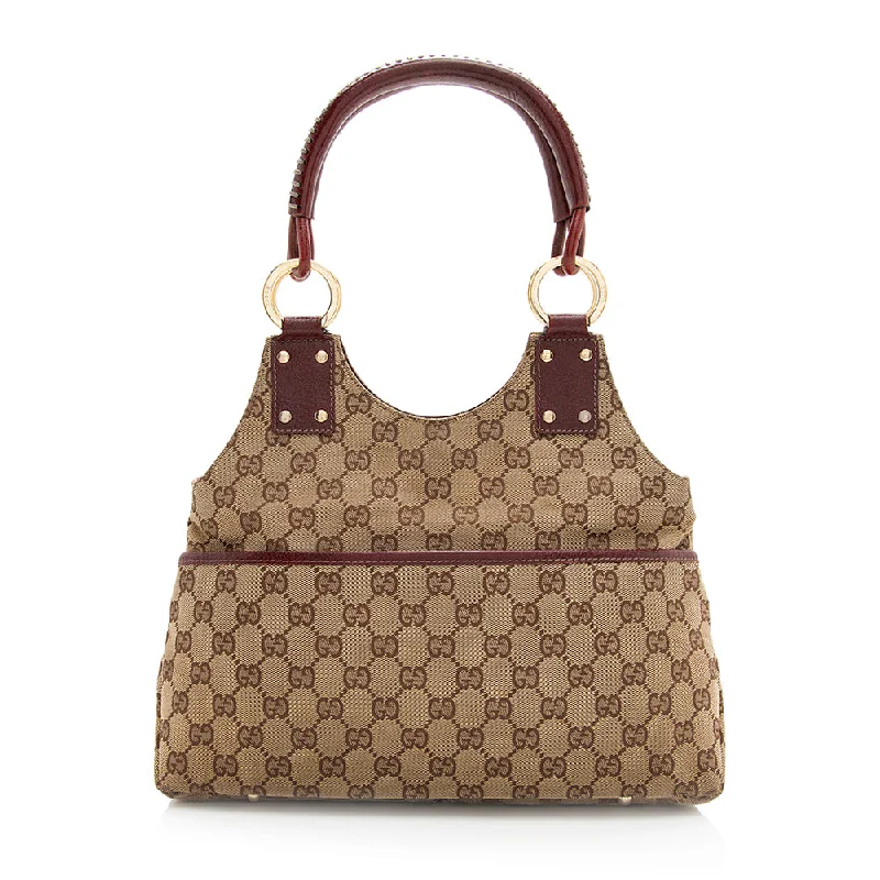 Women Gucci bags with a front - zip pocket for small itemsGucci GG Canvas Shoulder Bag