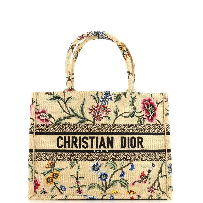 Christian Dior handbags with a snap - button closure and a decorative buckleBook Tote Embroidered Raffia Medium