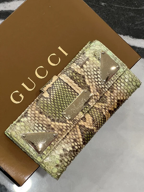 Women Gucci bags with a snap - button closure and a decorative charmGUCCI PYTHON CONTINENTAL WALLET